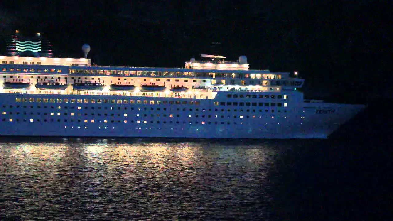 CRUISE SHIP ZENITH LEAVING GREECE BLOWING HORN AT NIGHT OCEAN LINER